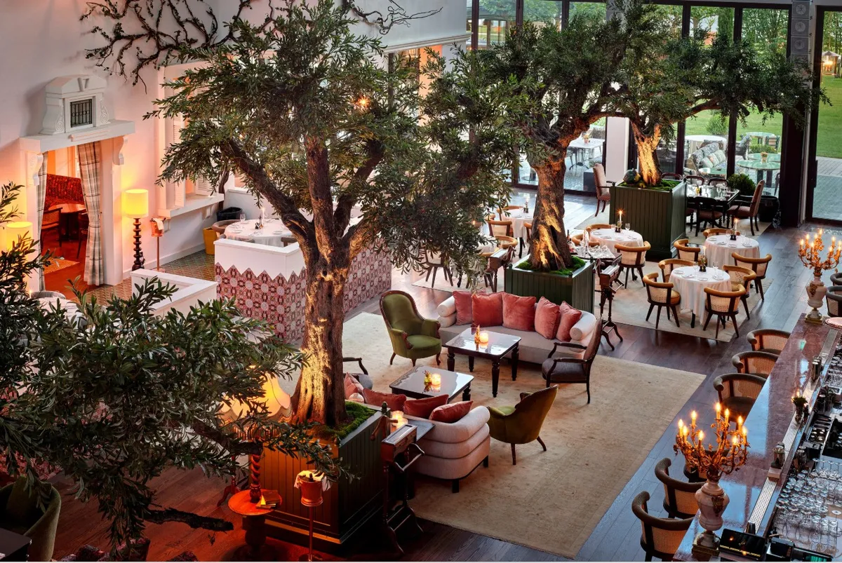 a crowd of people in a large building with signs