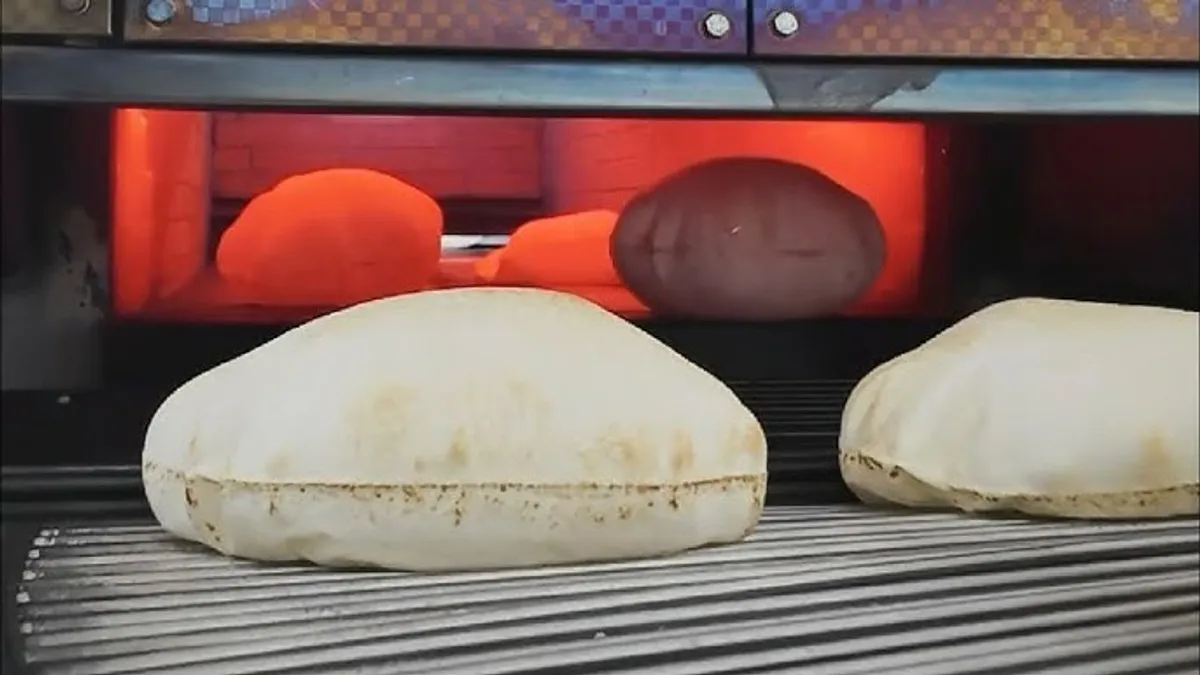 MacBook Pro on top of brown table